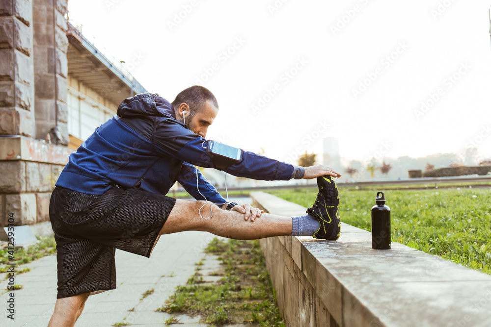 Man Warming Up Before Running Man Warming Up Before Running