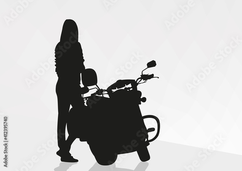 Cute girl drives a big motorcycle. Silhouette