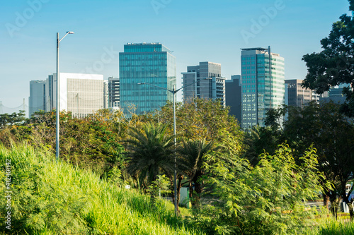 Beautiful Filinvest Alabang skyline in the morning, as seen from the a nearby park. Master planned modern green CBD in Metro Manila, Philippines. photo