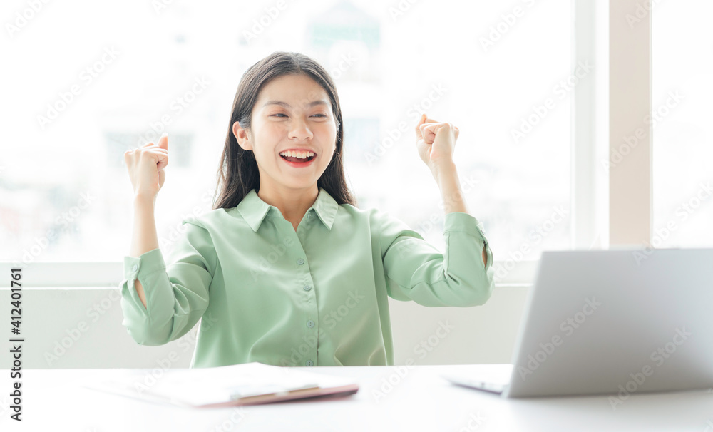 Portrait of young Asian businesswoman working on laptop Portrait of young Asian businesswoman working on laptop
