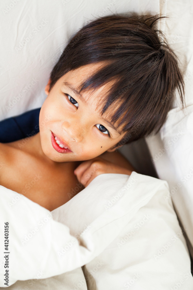 Portrait of smiling child/boy in bed after sleep. Portrait of smiling child/boy in bed after sleep.