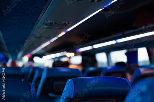 Blue seats and lights in a bus