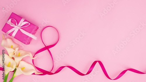 Wallpaper Mural Pink ribbon, flowers and gift appear on pink theme. Stop motion Torontodigital.ca