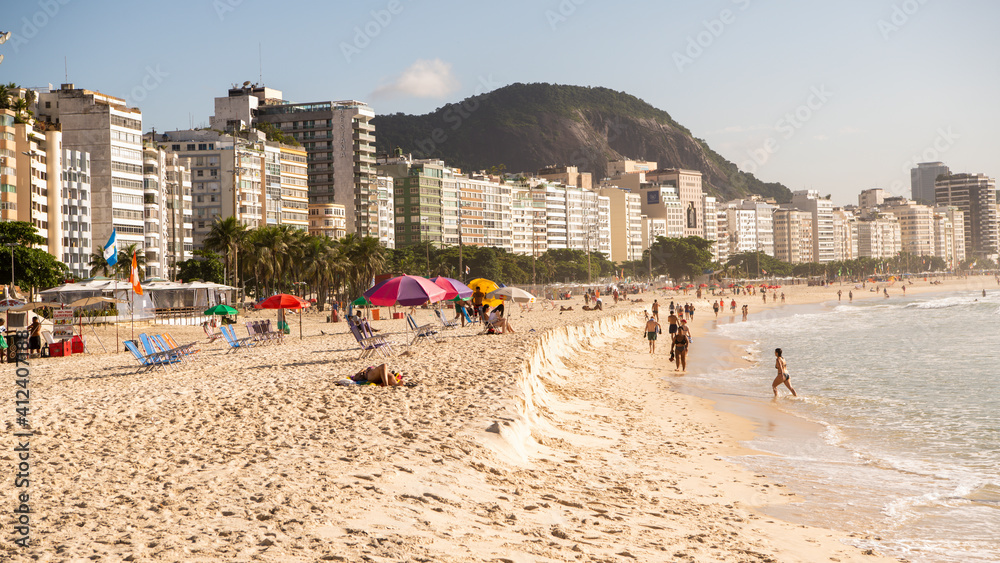 Citizens swim and sunbathe on the beach of Copacabana Citizens swim and sunbathe on the beach of Copacabana