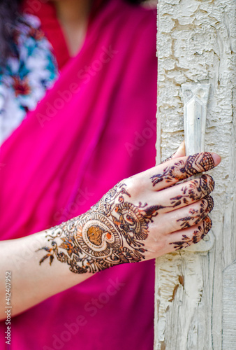 A woman with henna adorned arms and hands ! photo