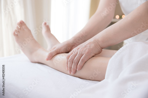 Close up Young woman getting Leg Reflexology massage at beauty spa salon. Massage for health