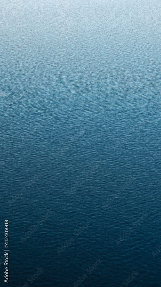 Vertical photography of a calm water surface - obrazy, fototapety, plakaty 