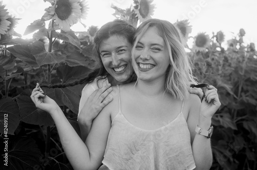 A black and white portrait of cousins posing of for a picture photo