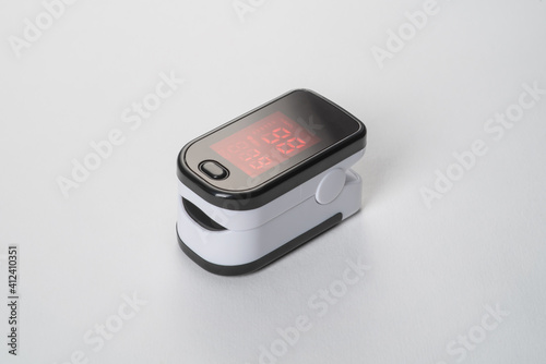 Portable digital fingertip oximeter isolated on white background