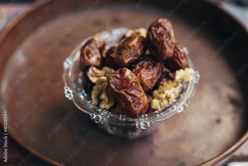 Date palm on a brown saucer Date palm on a brown saucer