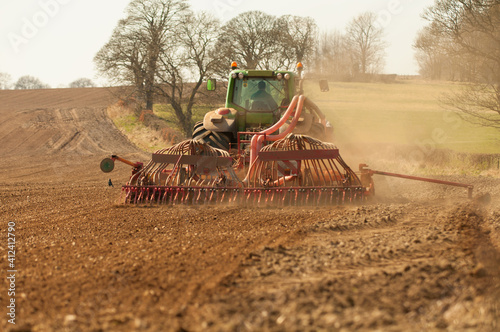 A tractor sowing a field