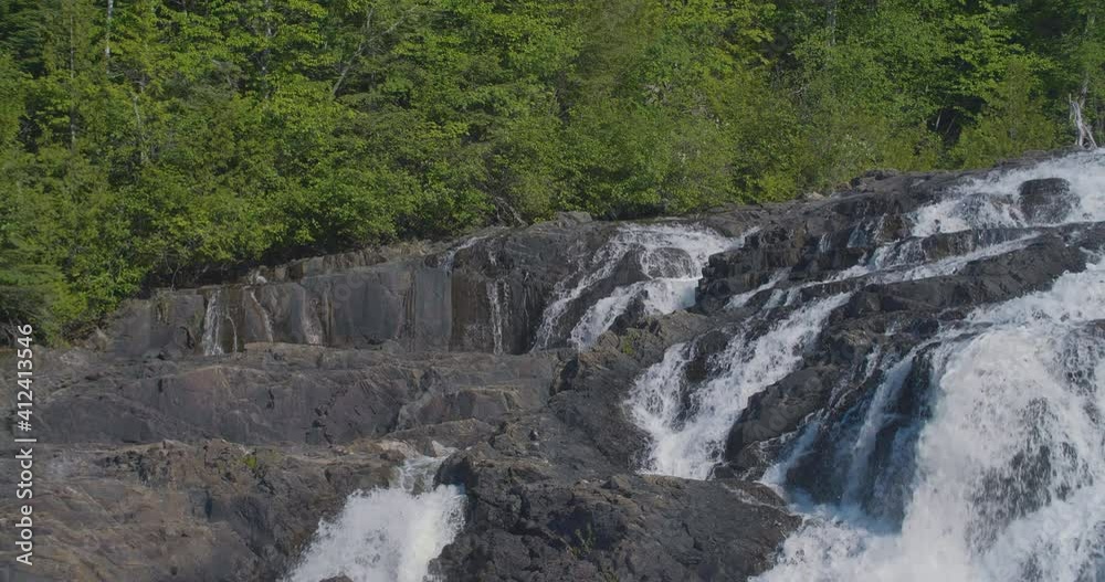 Separate mini waterfalls fall sequentially and in close proximity to each other, at the same time creating enchanting view Separate mini waterfalls fall sequentially and in close proximity to each other, at the same time creating enchanting view