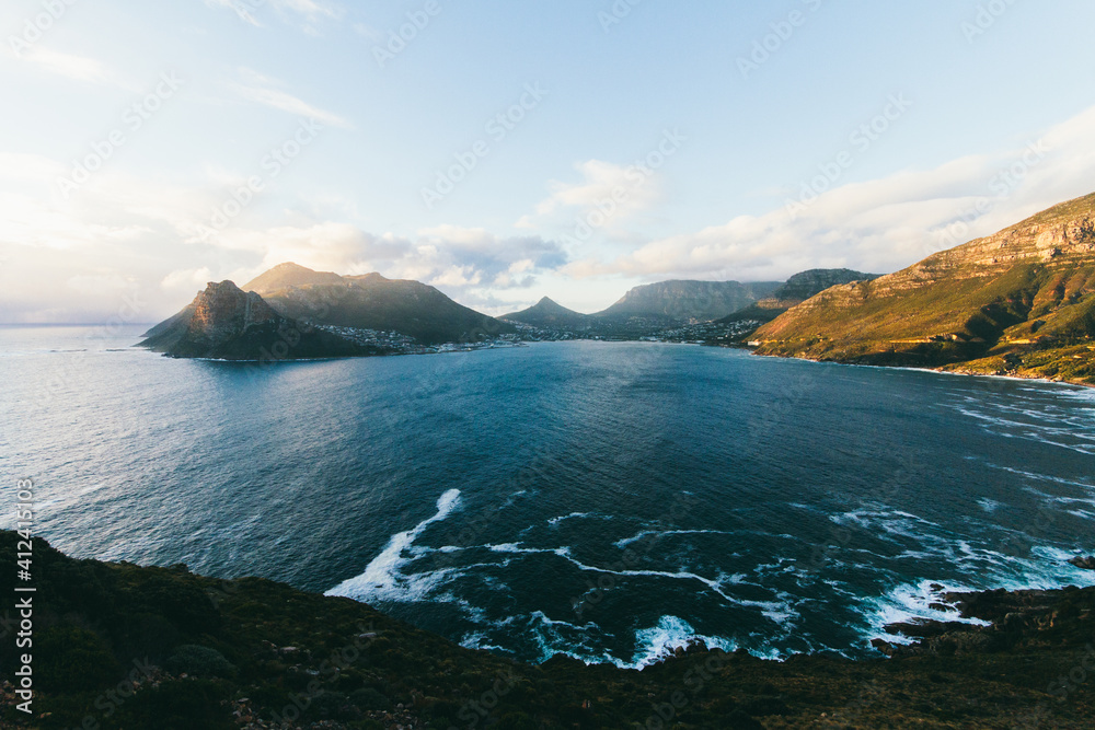 View of mountains and sea at sunset in a bay View of mountains and sea at sunset in a bay
