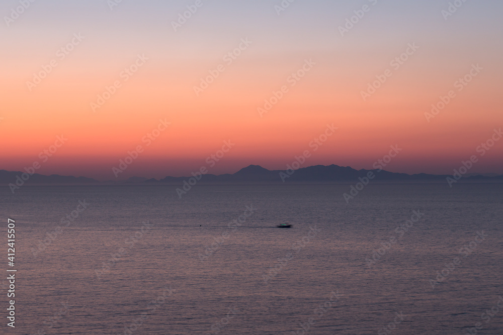 Just after sunset view across the sea looking towards Turkey Just after sunset view across the sea looking towards Turkey