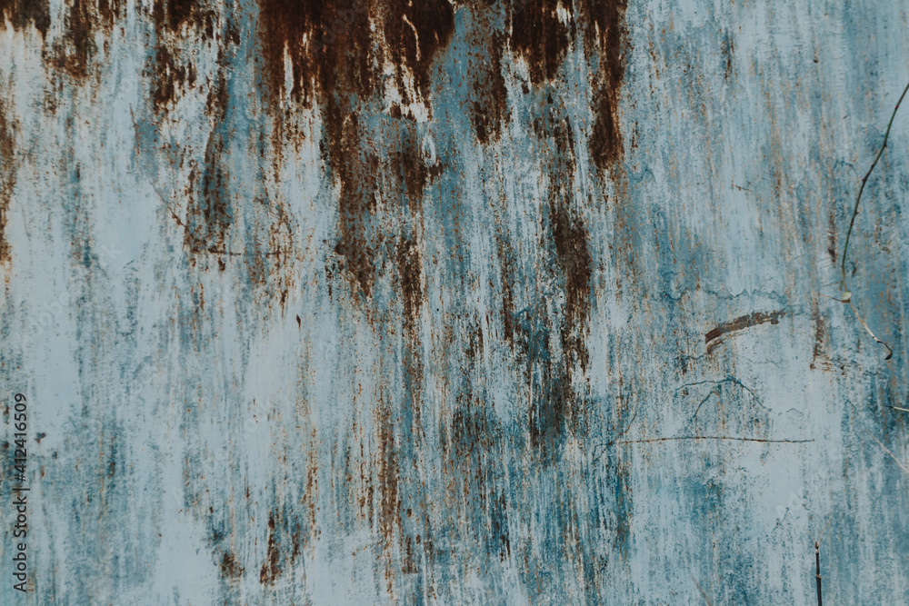 Fototapeta premium Multicolored background: rusty metal surface with peeling and cracking paint Natural defects Scratches, cracks, cracks, chips, dust, roughness, abrasion. Template for design and background.Copy space