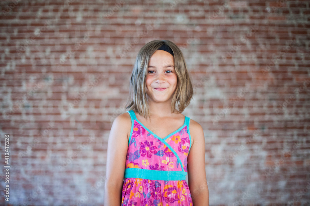 Girl in front of brick wall Girl in front of brick wall