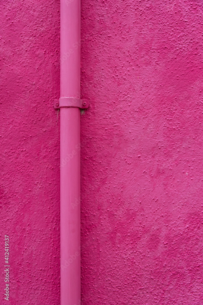 Pink pipe on a pink wall in Burano, Italy Pink pipe on a pink wall in Burano, Italy