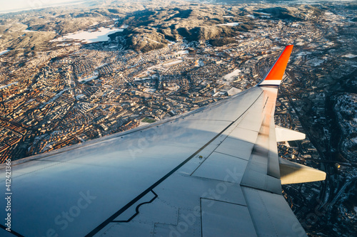 Airplane flying over Oslo City photo