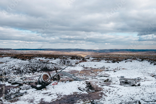 Wartime B-29 Superfortress plane wreckage on the snow covered moorland of Bleaklow, Derbyshire, UK.