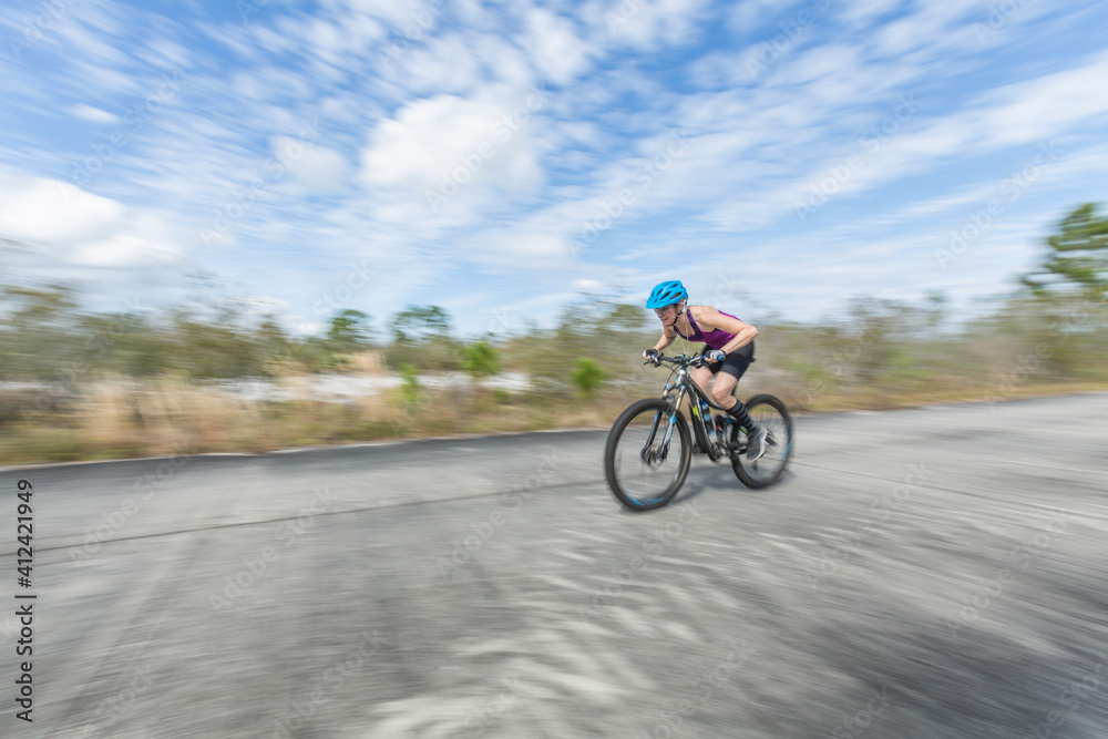 Female mountain biker riding the trails Female mountain biker riding the trails