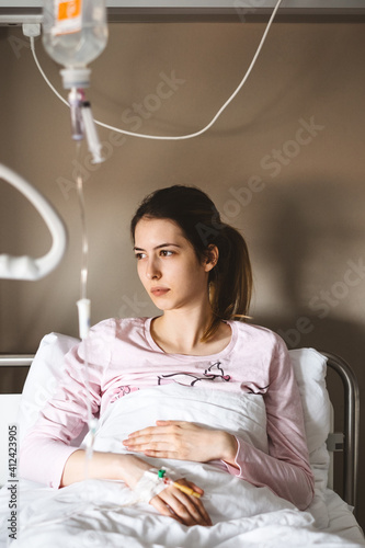 Young Female Patient in a Hospital Bed