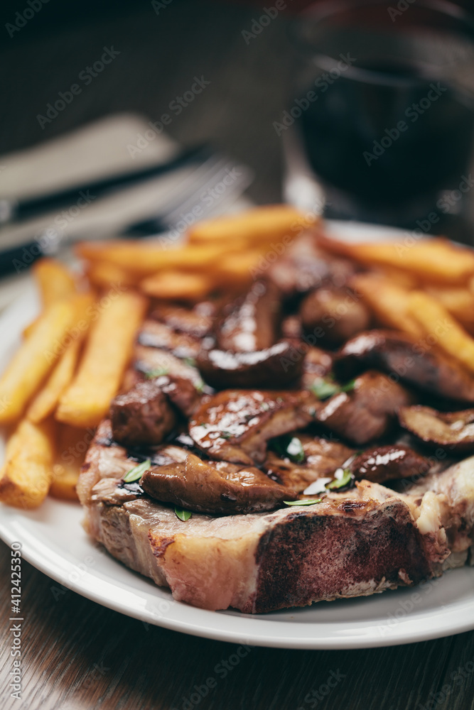Grilled beefsteak with potatoes and mushrooms Grilled beefsteak with potatoes and mushrooms