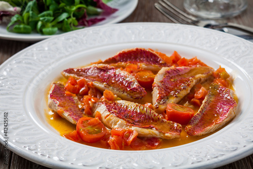 Red mullet with fresh cherry tomatoes photo