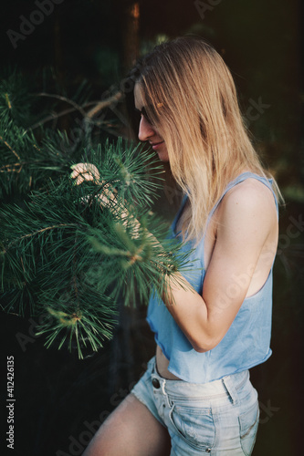 Young blonde woman wearing sunglasses photo