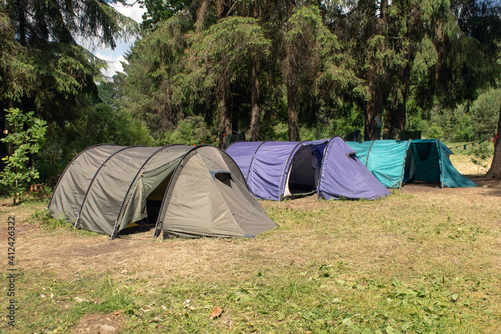 tourist parking with tents in the forest