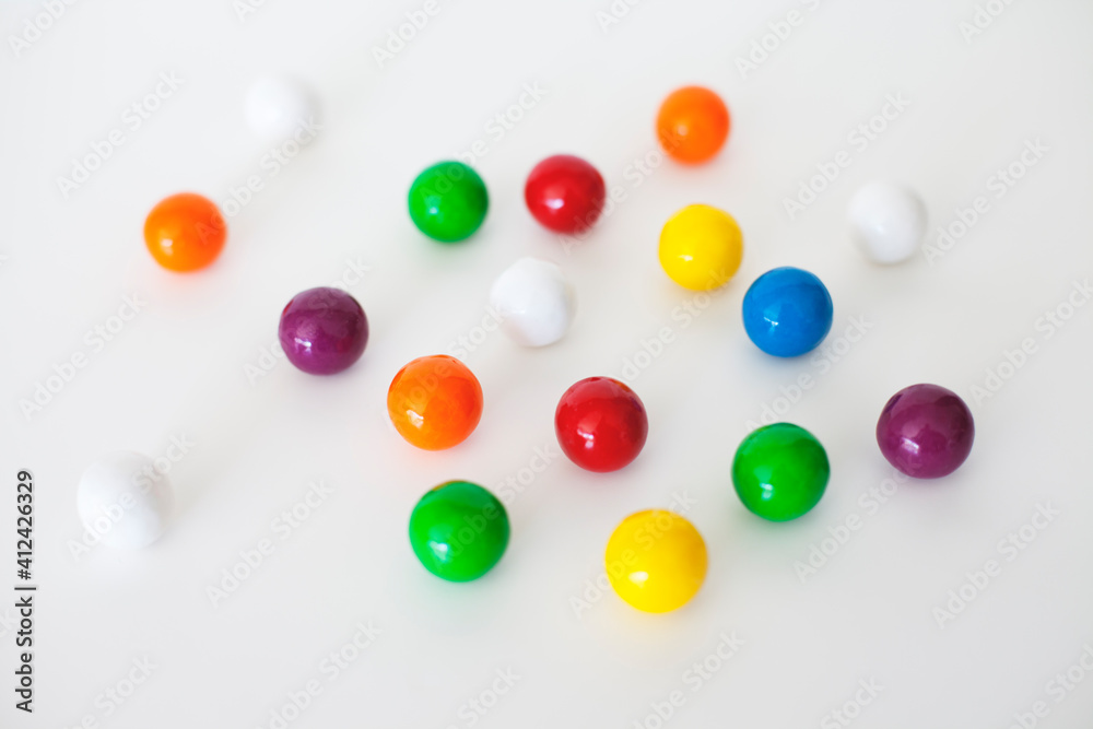 colourful group of gum balls against a white background colourful group of gum balls against a white background