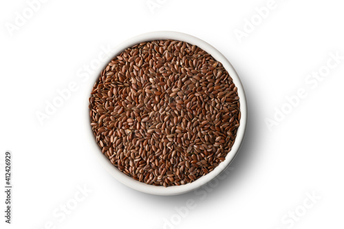 flax seeds in a cup isolated on white background, top view