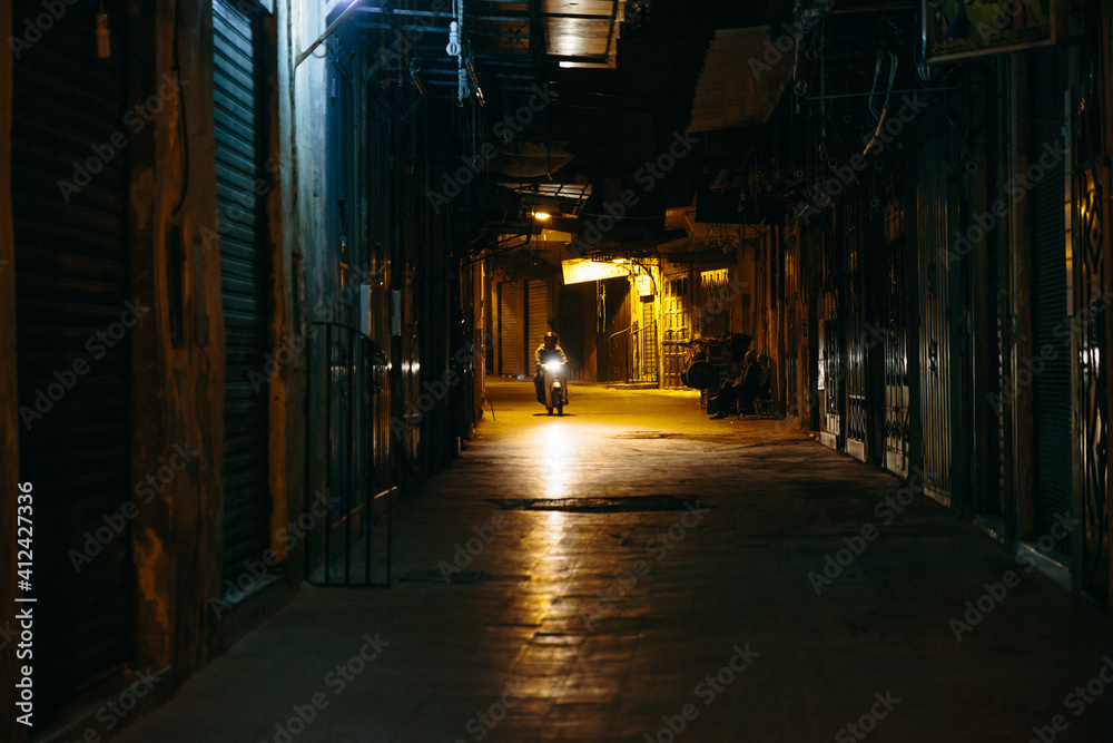Dark alley with a moped in the back Dark alley with a moped in the back