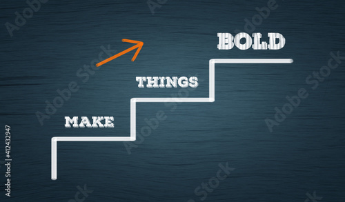 Make Things Bold  - Business growth and improvement concept. upward stair and arrow in blue chalkboard with words "Make things bold" 