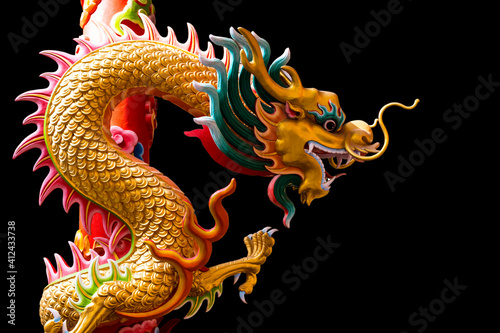 China Dragon statue in Chinese temple on black isolated background © Atlantist studio