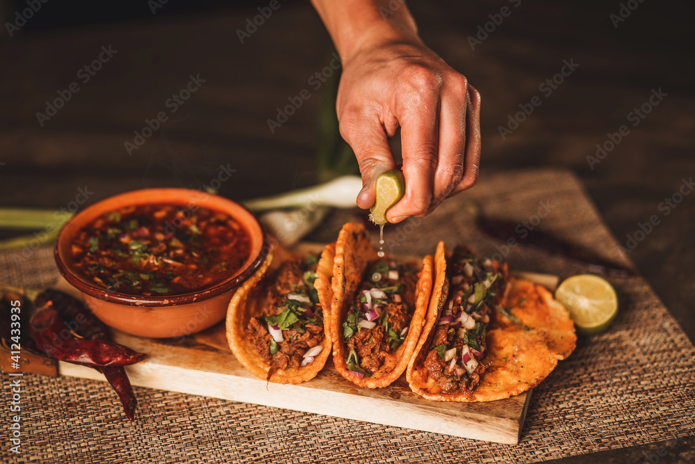 tabla arreglada con tacos de birria, barbacoa y consome Stock Photo | Adobe  Stock