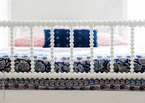 White antique spindle bed photo
