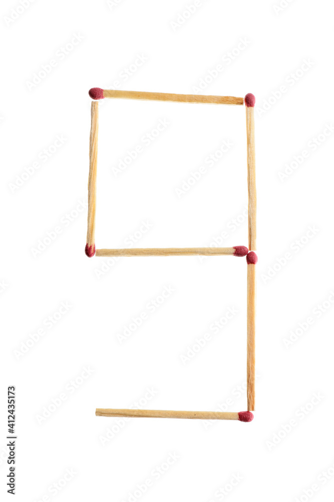 Number 9 made of matches on white background Number 9 made of matches on white background