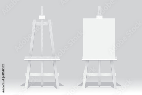 Wooden easel stand with blank canvas on white background