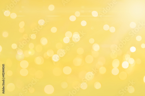 Defocused blurred bright yellow holiday background