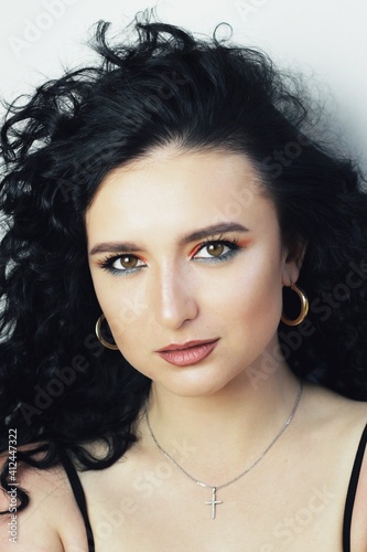 Obraz na płótnie Beautiful young brunette model with bright make-up and curly hairstyle w salonie