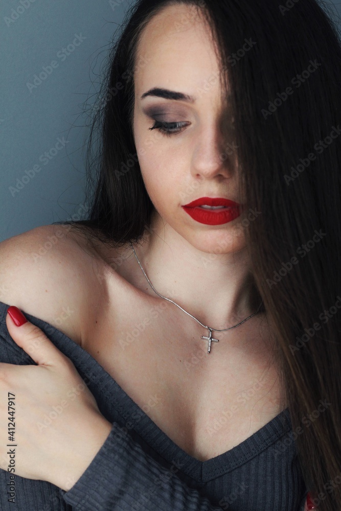 Beautiful young model, longhair girl with bright make-up, red lips