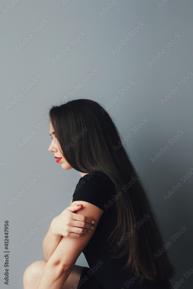 Beautiful young model, longhair girl with bright make-up, red lips