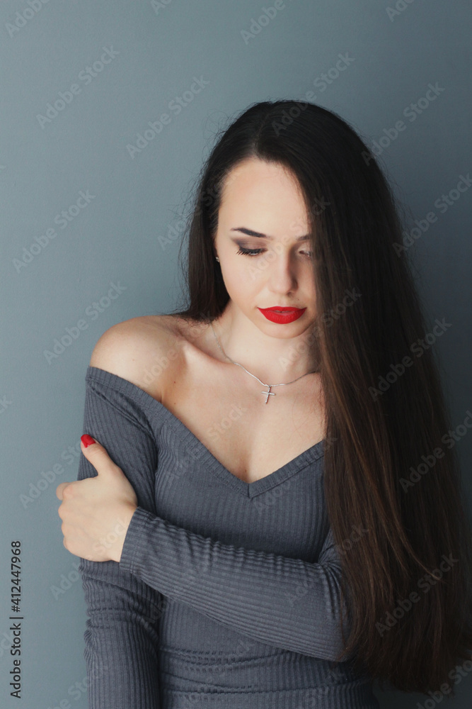 Beautiful young model, longhair girl with bright make-up, red lips