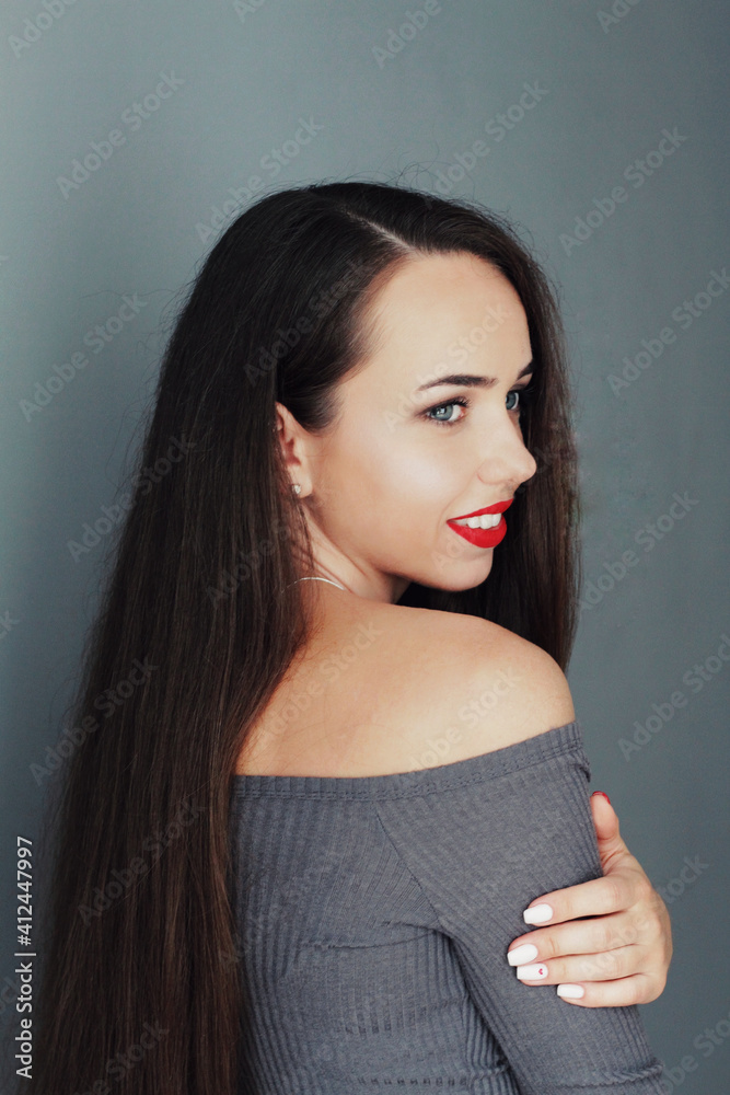 Beautiful young model, longhair girl with bright make-up, red lips