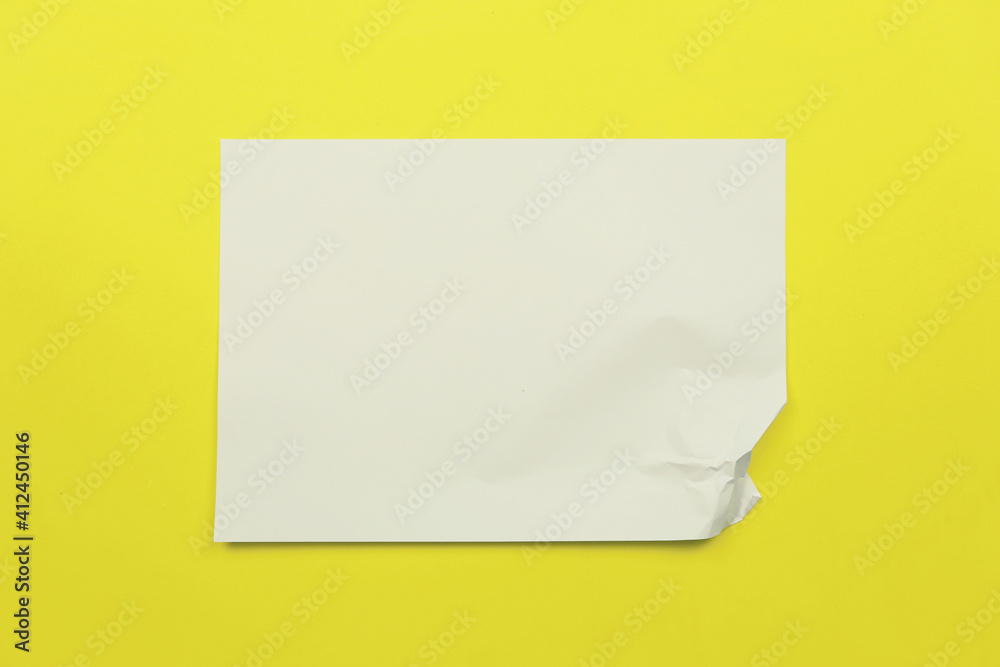 Wrinkled white paper on yellow art paper background. Wrinkled white paper on yellow art paper background.