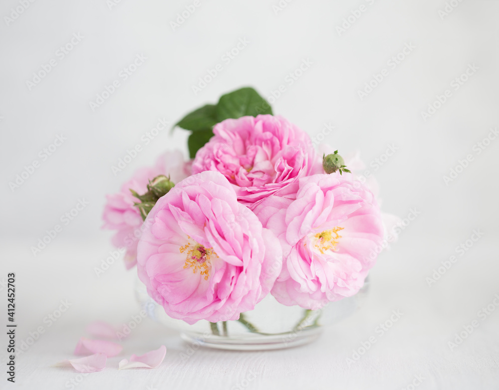 Bouquet of pale pink Roses against of light grey wooden background. Tea Roses. Shallow depth of field. Selective focus. Bouquet of pale pink Roses against of light grey wooden background. Tea Roses. Shallow depth of field. Selective focus.