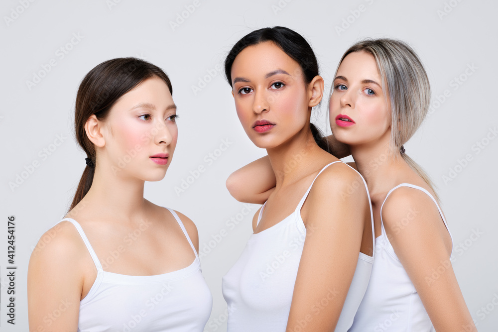 Beautiful asian, caucasian and african girls posing in studio Beautiful asian, caucasian and african girls posing in studio