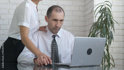 Harassment affair. A woman seduce a man and try to help him with computer work.