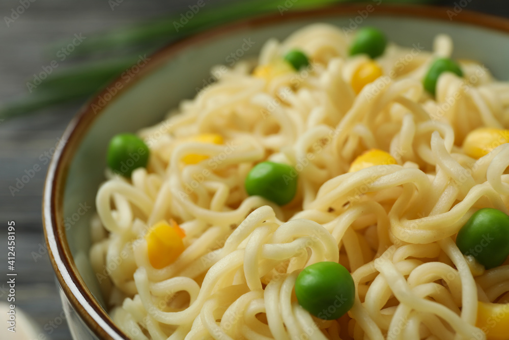 Plate with cooked noodles and vegetables, close up Plate with cooked noodles and vegetables, close up