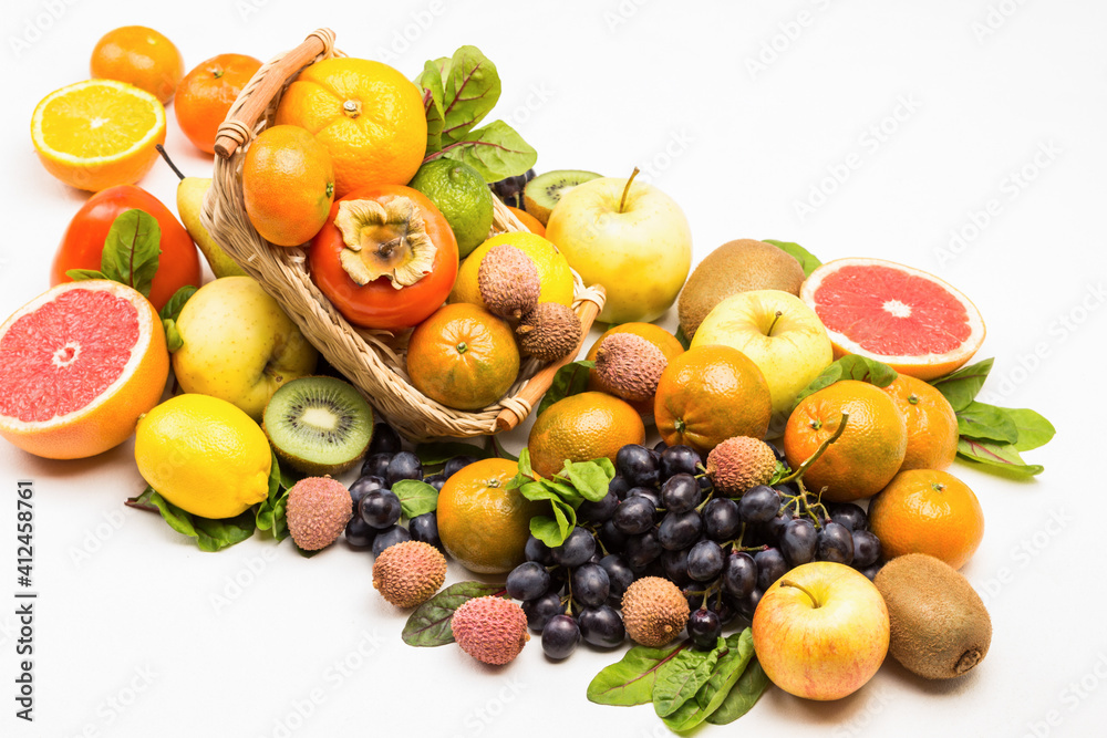 Set of varied, multicolored exotic fruits. Mandarins, grapefruit, lychee, kiwi and grapes with chard leaves Set of varied, multicolored exotic fruits. Mandarins, grapefruit, lychee, kiwi and grapes with chard leaves